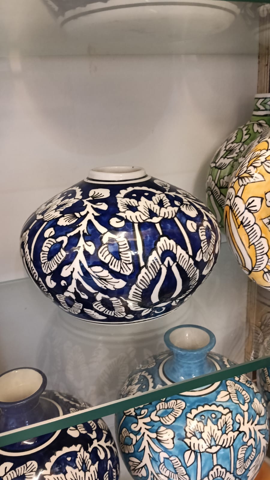 Handcrafted ceramic flower vase with traditional painted motifs