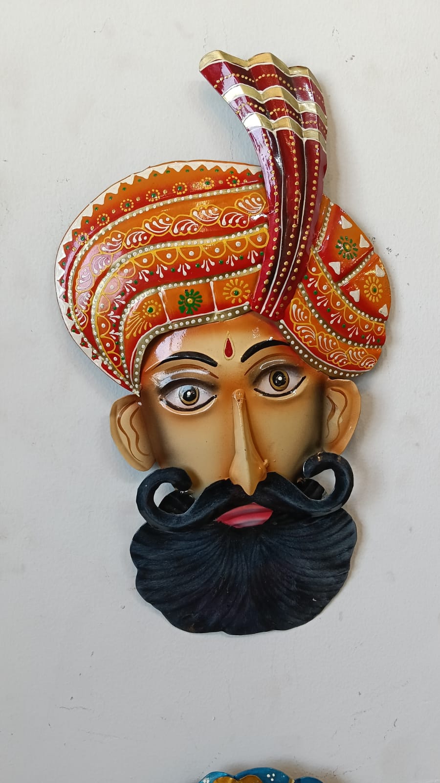 Traditional Rajasthani woman face wall mask in painted iron